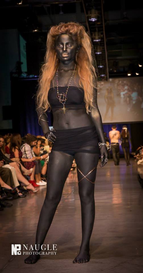 Alber Rezko Jewelry worn by a model body painted in black at the san diego fashion week 2014 Night 5: Finale Runway