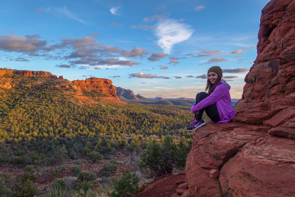 Blogger Nihan is sitting on the red rocks at the  Boynton Canyon Vortex and looking at the gorgeous view