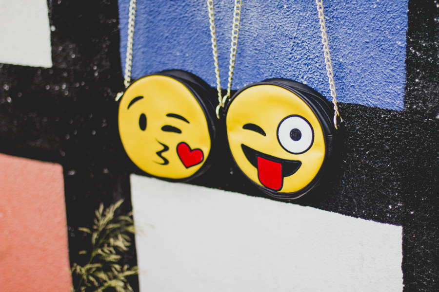 Kissing emoji and stock-out tongue emoji purses