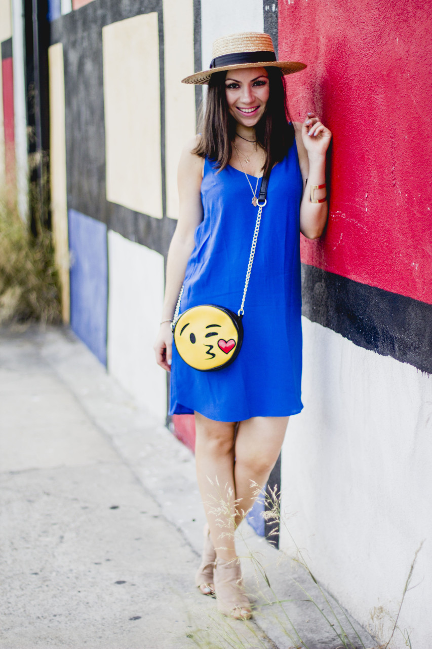 Nihan at the Mondrian wall wearing Topshop blue dress, Lack of Color spencer boater hat, JustFab nude booties and kissing emoji purse
