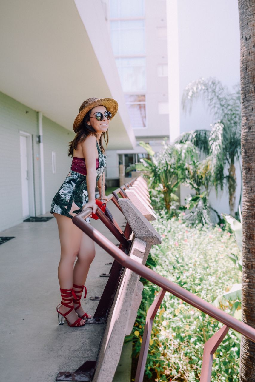 Style with Nihan at Hotel Valley Ho Scottsdale wearing Lack of Color hat, Topshop palm print playsuit and Public Desire red heels